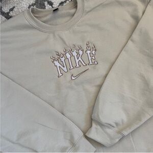 Cream Nike fire embroidered Crewneck